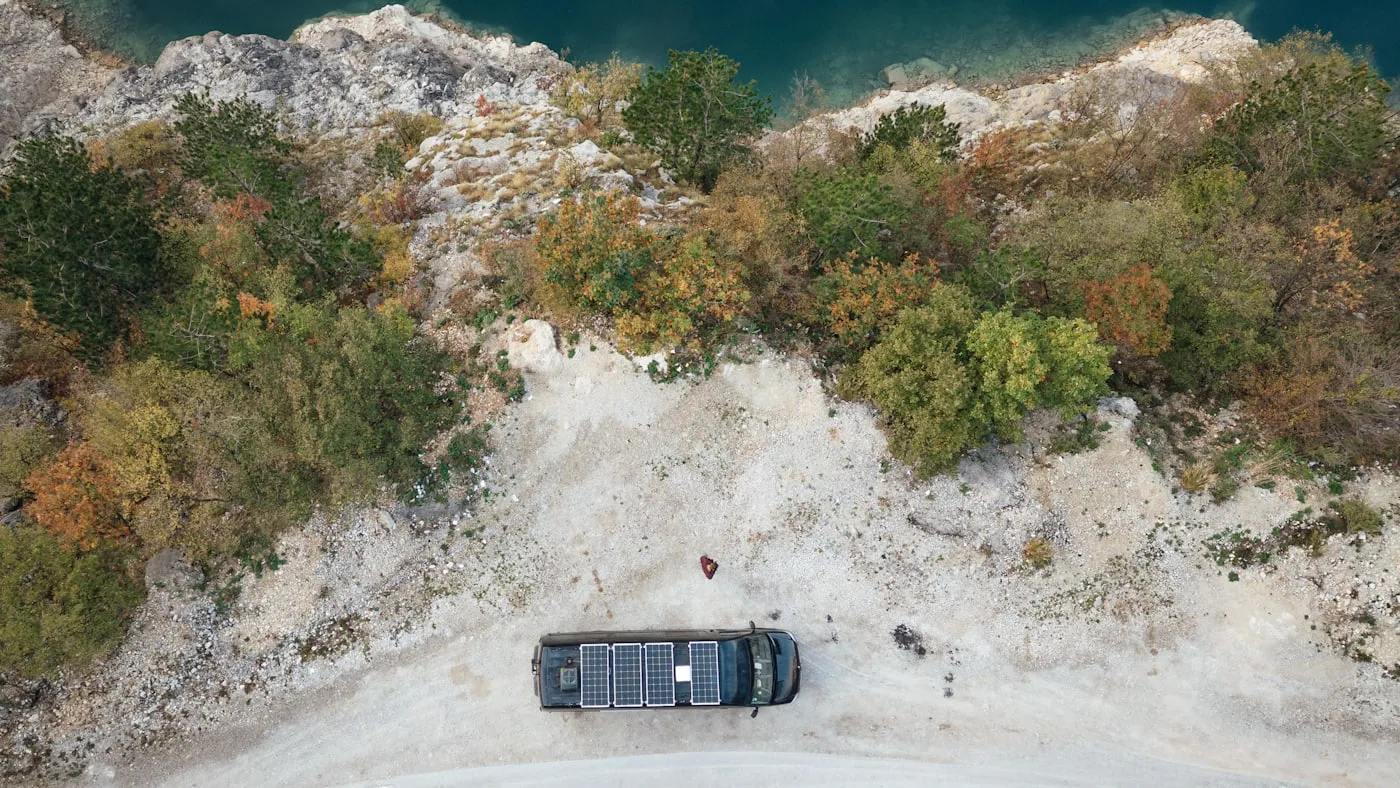 Solar-powered campervan at a remote bivouac